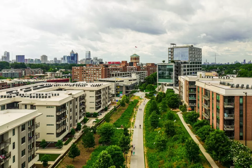 Aerial view of the Atlanta Beltline walking and biking trail with mid-rise buildings on either side.